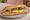 Bánh Mì Ốp La: an illustration of egg, pâté, mayonnaise, butter and more on bánh mì baguette.