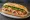 Bánh Mì Phố Huế: an illustration of pork, pâté, đồ chua, cucumber and more on bánh mì baguette.
