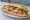 Bánh Mì Phượng Đặc Biệt: an illustration of pork, pâté, đồ chua, cucumber and more on bánh mì baguette.