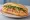 Bánh Mì Ruốc: an illustration of pork floss, đồ chua, cucumber, cilantro and more on bánh mì baguette.