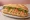 Bánh Mì Ruốc Bông: an illustration of pork floss, đồ chua, cucumber, cilantro and more on bánh mì baguette.