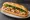 Bánh Mì Sài Gòn: an illustration of pork, pâté, butter, đồ chua and more on bánh mì baguette.