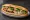 Bánh Mì Tết: an illustration of pork, egg, đồ chua, cucumber and more on bánh mì baguette.