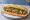 Bánh Mì Thịt Băm: an illustration of pork, đồ chua, cucumber and cilantro on bánh mì baguette.