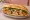 Bánh Mì Thịt Bằm Trứng: an illustration of pork, egg, đồ chua, cucumber and more on bánh mì baguette.