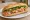 Bánh Mì Thịt Heo Mắm: an illustration of pork, shrimp, fish sauce, đồ chua and more on bánh mì baguette.