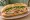 Bánh Mì Thịt Nguội Sài Gòn: an illustration of pork, chả lụa, pâté, mayonnaise and more on bánh mì baguette.