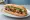 Bánh Mì Thịt Xiên: an illustration of pork, đồ chua, cucumber and cilantro on bánh mì baguette.