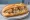 Bánh Mì Xôi: an illustration of pork and rice on bánh mì baguette.