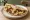 Bayd ma' Awarma (بيض مع عوارما): an illustration of egg and lamb on pita.