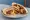 Bayd ma' Sujuk (بيض مع سجق): an illustration of egg and sausage on pita.