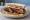 Beef Rib Sandwich: an illustration of pickle and onion on white bread.
