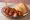Berliner Currywurst: an illustration of tomato, paprika and curry powder.
