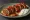 Beyti Sarma: an illustration of lamb and beef on pita.