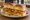 Bhurji Pav: an illustration of butter, egg, onion, tomato and more on bread.