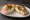 Bialy with Cream Cheese: an illustration of cream cheese and onion.