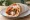 Bifteki Gemisto se Pita: an illustration of beef, pork and cheese on pita.
