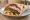 Bifteki se Pita: an illustration of beef and pork on pita.
