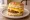 Biscuit Sandwich (Southern): an illustration of bacon, sausage, ham, egg and more on buttermilk biscuit.