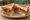 BLT Sandwich: an illustration of bacon, lettuce and tomato on bread.