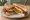 BLT with Egg: an illustration of bacon, egg, lettuce, tomato and more on white bread.