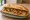Bocadillo con Mojo: an illustration of pork and cilantro on baguette.