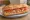 Bocadillo de Atún con Tomate: an illustration of tuna and tomato on baguette.