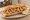 Bocadillo de Calamares con Limón: an illustration of squid and lemon on baguette.