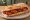 Bocadillo de Chorizo: an illustration of pork, chorizo, paprika and garlic on baguette.