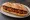 Bocadillo de Chorizo Frito: an illustration of pork, chorizo, paprika, olive oil and more on baguette.