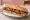 Bocadillo de Escalivada: an illustration of eggplant, pepper, onion and olive oil on baguette.