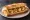 Bocadillo de Gambas: an illustration of shrimp, olive oil, garlic and parsley on baguette.