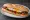 Bocadillo de Huevo Frito con Pimientos: an illustration of egg, pepper and olive oil on baguette.