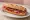 Bocadillo de Jamón con Tomate: an illustration of jamón, tomato and olive oil on baguette.