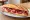 Bocadillo de Jamón Ibérico: an illustration of jamón and olive oil on baguette.
