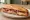 Bocadillo de Jamón y Queso: an illustration of jamón, manchego and olive oil on baguette.