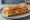 Bocadillo de Judiones: an illustration of beans, onion, garlic, olive oil and more on baguette.