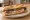 Bocadillo de Lacón con Grelos: an illustration of pork, olive oil and paprika on baguette.
