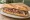 Bocadillo de Lechazo: an illustration of lamb, garlic and olive oil on baguette.