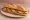 Bocadillo de Lomo a la Plancha: an illustration of pork, olive oil and garlic on baguette.