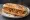 Bocadillo de Migas: an illustration of pork, chorizo, garlic, olive oil and more on baguette.