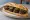 Bocadillo de Morcilla: an illustration of morcilla, onion, rice and olive oil on baguette.