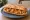Bocadillo de Papas Arrugadas: an illustration of potato, garlic and olive oil on baguette.