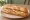 Bocadillo de Pechuga: an illustration of chicken and olive oil on baguette.