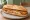 Bocadillo de Pollo Empanado: an illustration of chicken, egg and olive oil on baguette.