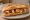Bocadillo de Pulpo a la Gallega: an illustration of octopus and olive oil on baguette.