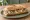 Bocadillo de Queso Cabrales con Nueces: an illustration of walnuts on baguette.