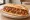 Bocadillo de Ropa Vieja: an illustration of beef, tomato, pepper, onion and more on baguette.
