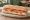 Bocadillo de Salmón Ahumado: an illustration of salmon and cream cheese on baguette.