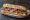 Bocadillo de Secreto Ibérico: an illustration of pork and olive oil on baguette.